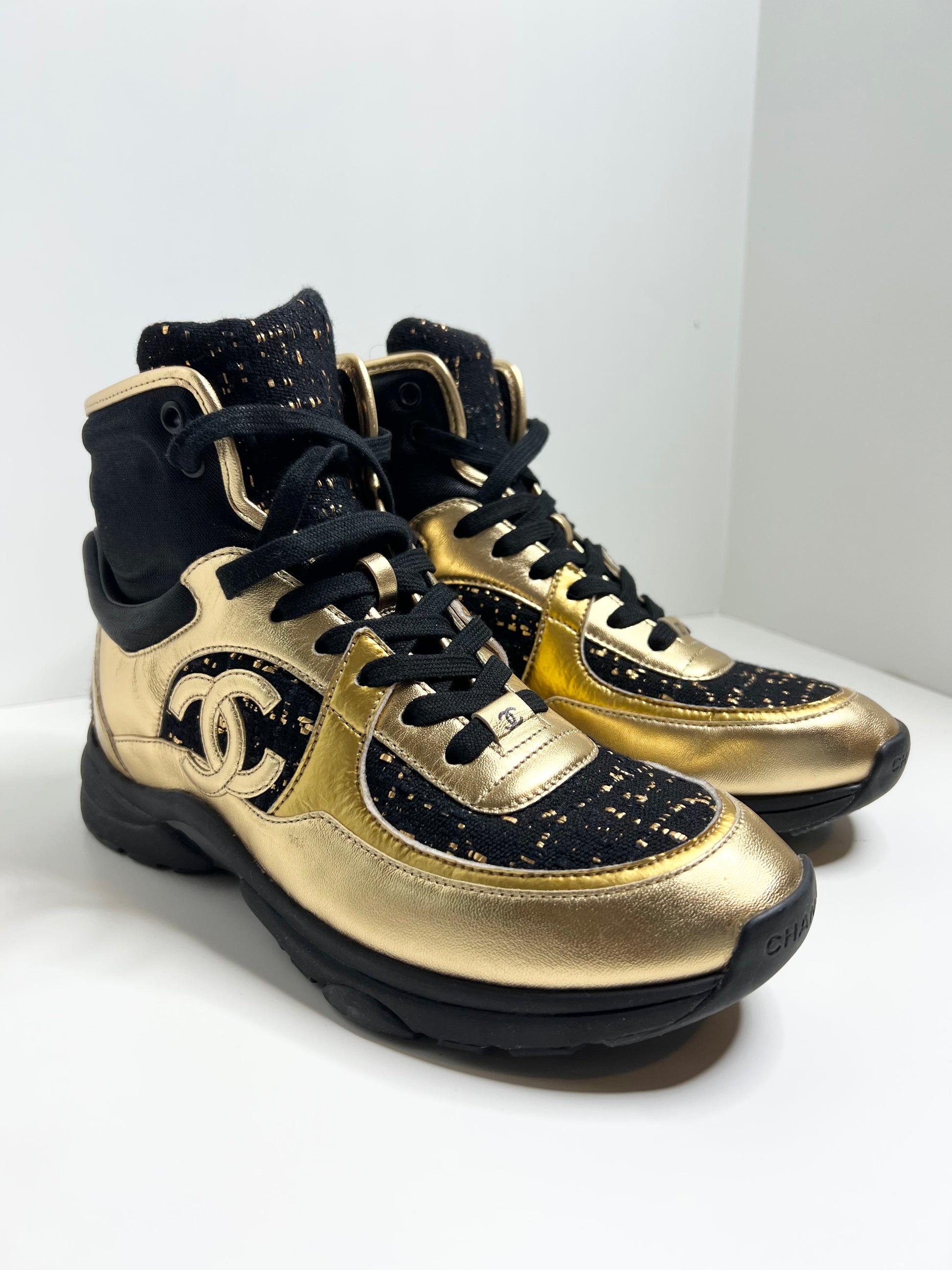 Chanel black hot sale and gold sneakers